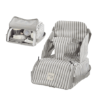 Trona Portátil Botton Strips de Walking Mum colocada en una silla de comedor